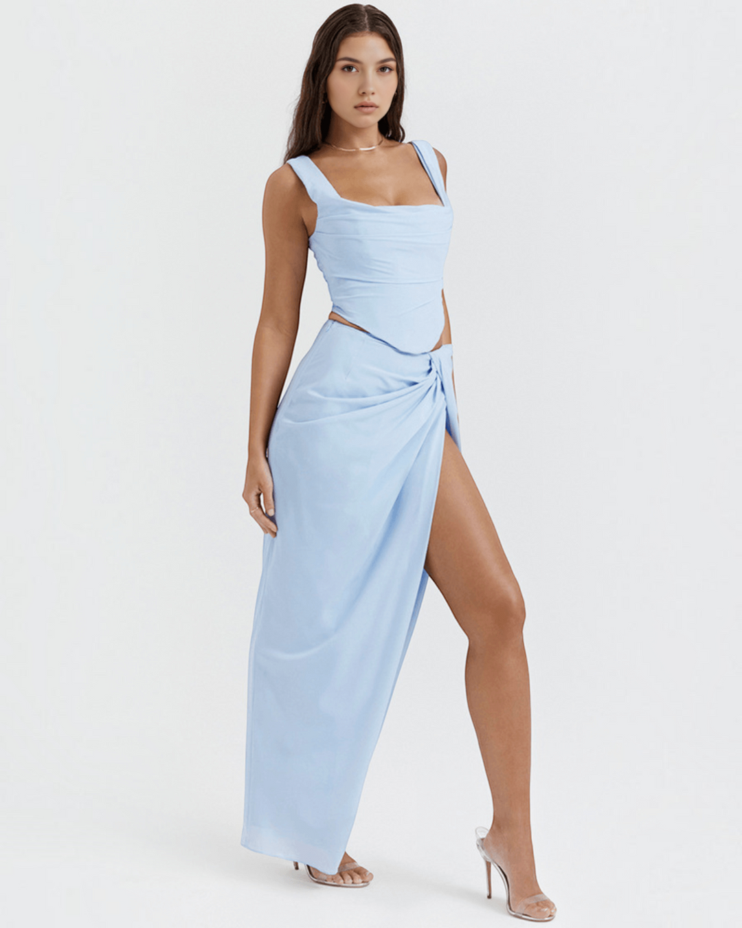 Luna Moda light blue corset top and matching high-slit maxi skirt set worn by a model on a white background
