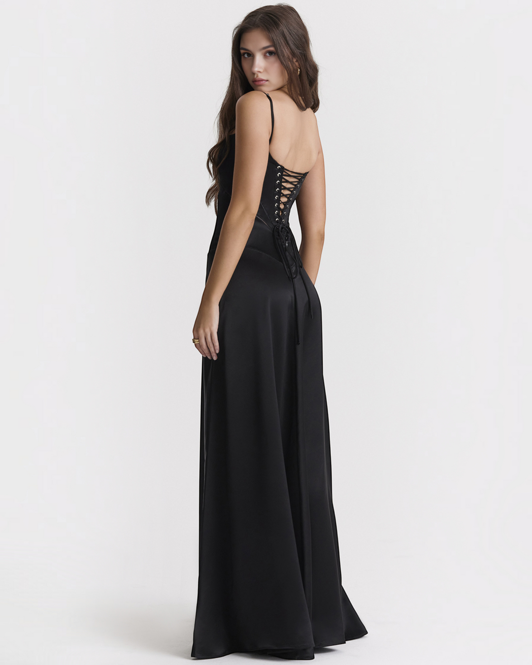 Luna Moda Noelle black satin evening gown with a corset-style lace-up back and spaghetti straps on a female model