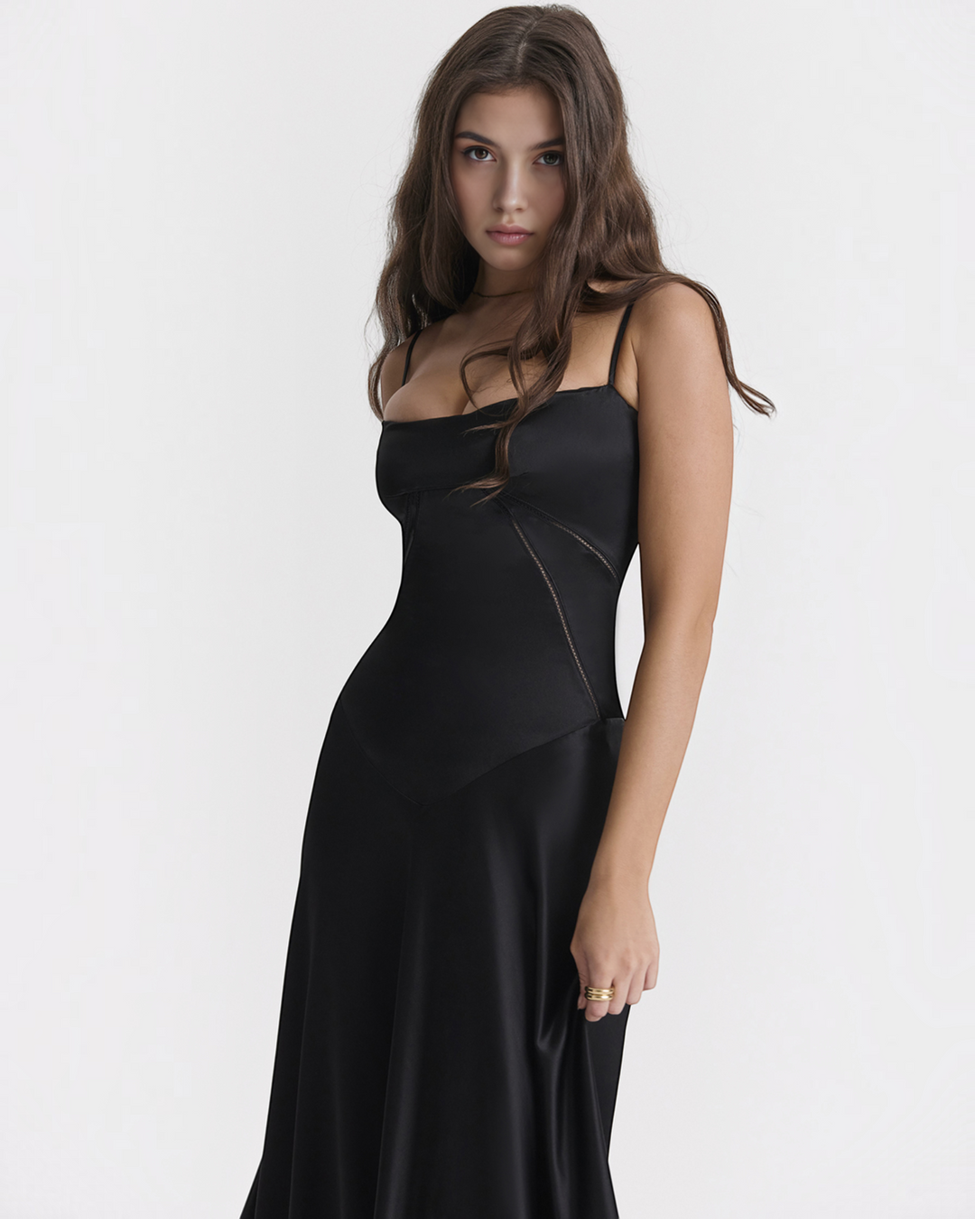 Luna Moda Noelle black bustier evening dress with thin straps and a flowing skirt worn by a model