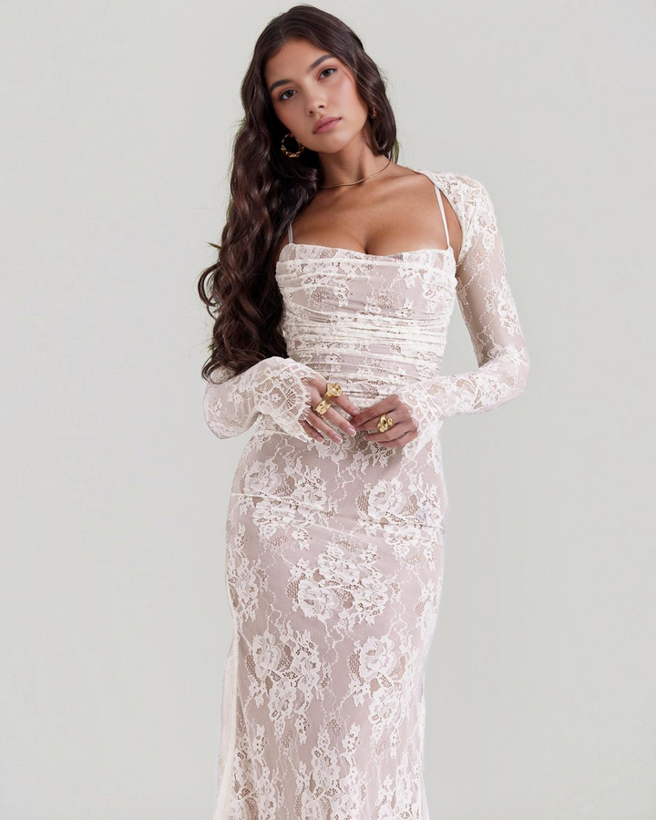 Luna Moda maxi lace dress with structured corset bodice and long sleeves worn by a model in a studio setting