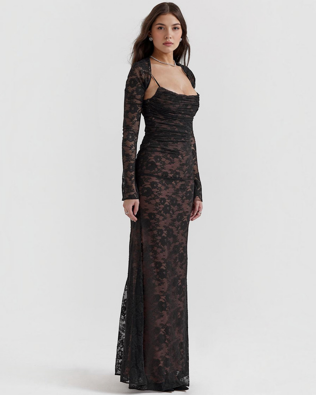 Luna Moda black lace maxi dress with a structured corset bodice and long sleeves worn by a model in a studio