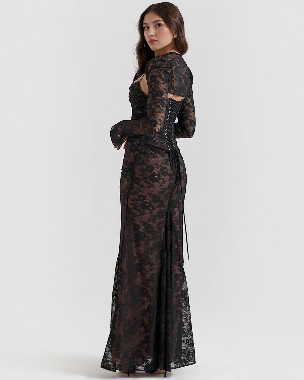 Luna Moda black lace maxi dress with a structured corset bodice and back lace-up detail worn by a model
