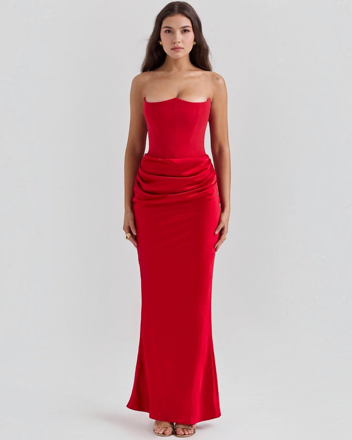 Luna Moda Serene strapless red satin gown featuring a structured corset bodice and elegant draped waist detail.
