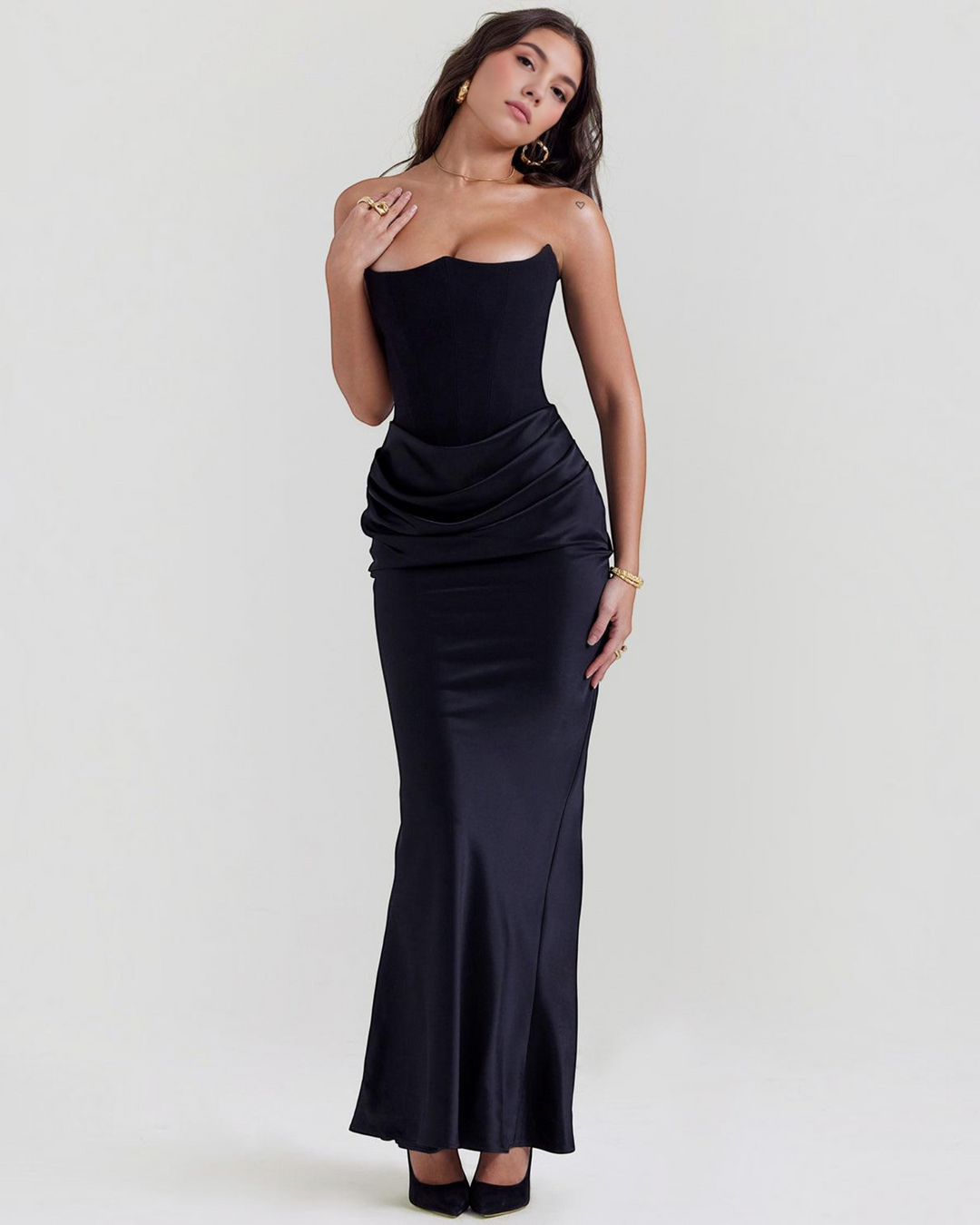 Luna Moda black strapless satin gown with a fitted bodice and draped waist detail worn by a model