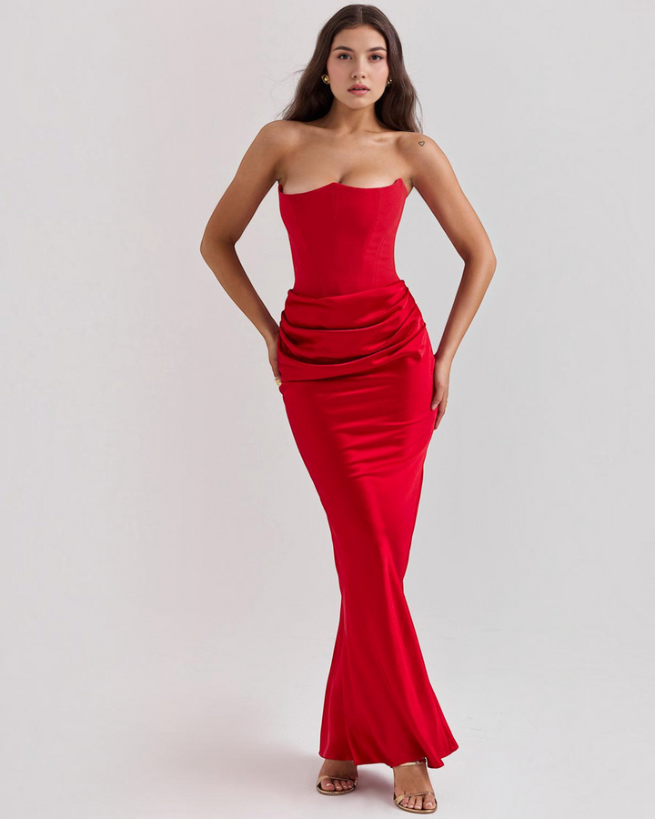 Luna Moda red satin strapless corset gown with a draped waistline worn by a model against a neutral background