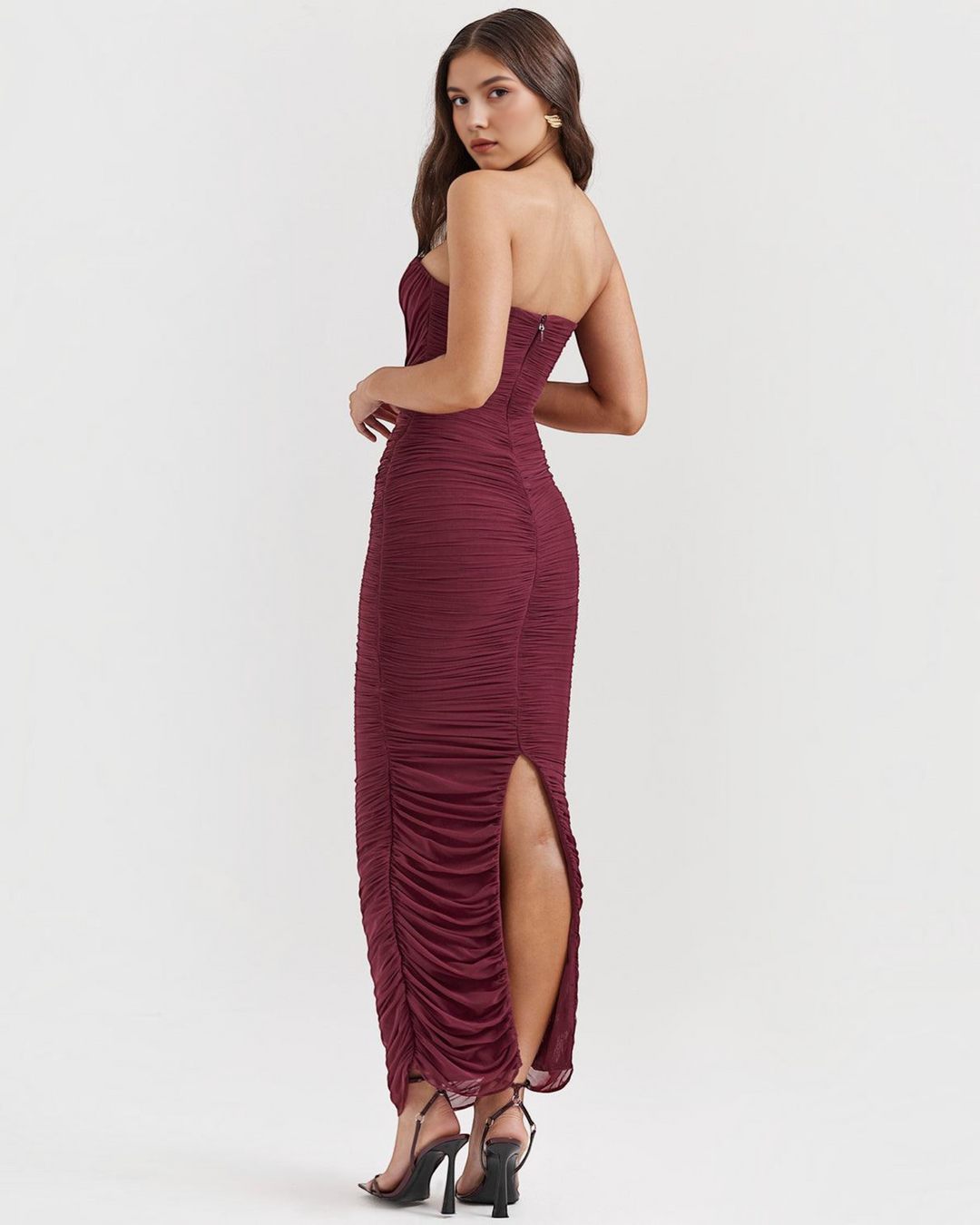 Luna Moda Amaris strapless burgundy mesh maxi dress with ruched detailing and back slit on a model