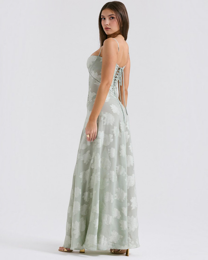 Luna Moda sage green floral maxi dress with a sweetheart neckline and lace-up back detail worn by a model