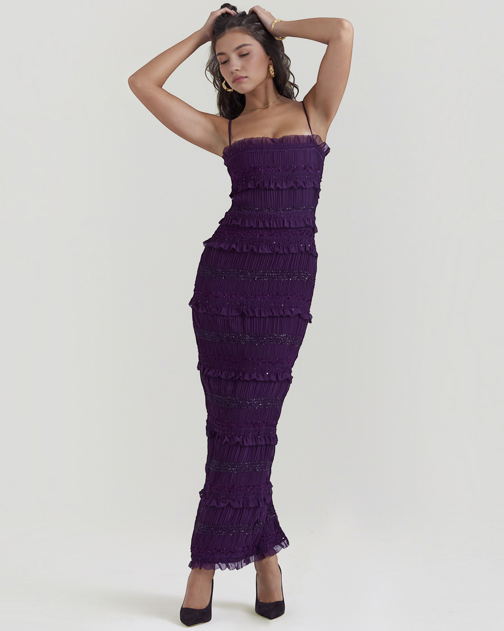Luna Moda Solara maxi dress in deep purple satin with sequin pleats, ruffles, and spaghetti straps on a model.