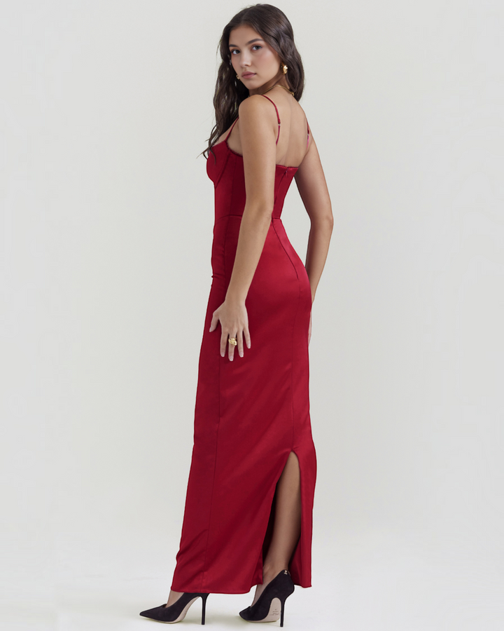 Luna Moda Rubina ruby red satin evening gown with lace-trimmed bodice and back slit worn by a model