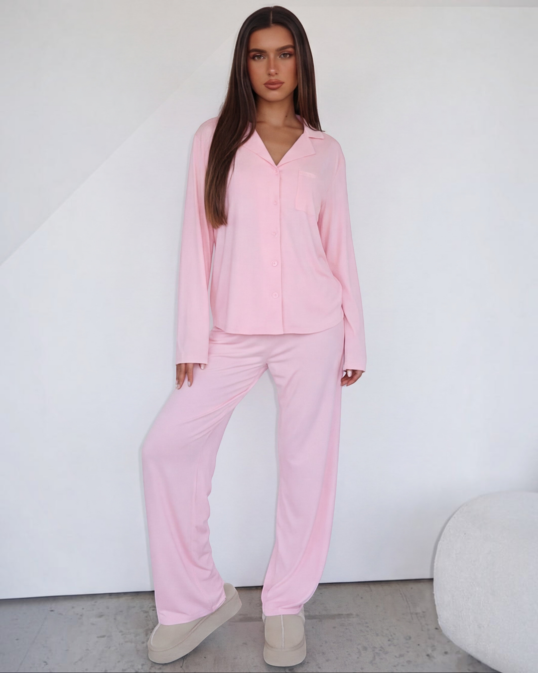Luna Moda blush pink lounge set featuring a long-sleeve button-down shirt and wide-leg trousers on a model.