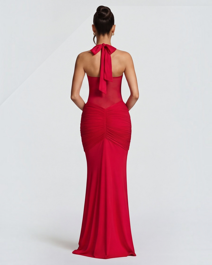 Luna Moda red mermaid gown with mesh waist detail, ruched hips, and a tie-back halter neck, back view