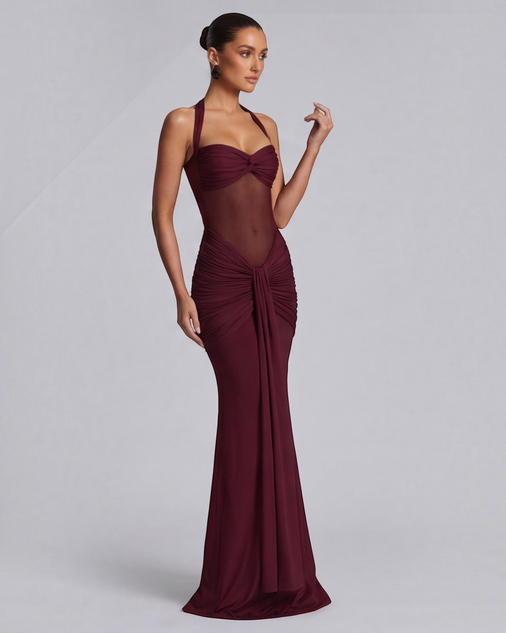 Luna Moda wine red mermaid dress with mesh waist detail and ruched hips on a model against a grey background