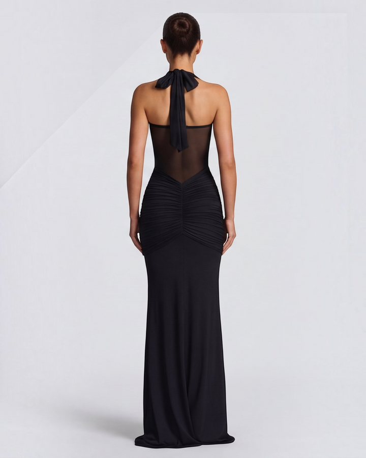 Luna Moda black mermaid gown with mesh waist detail, ruched hips, and halter neck, shown from the back.