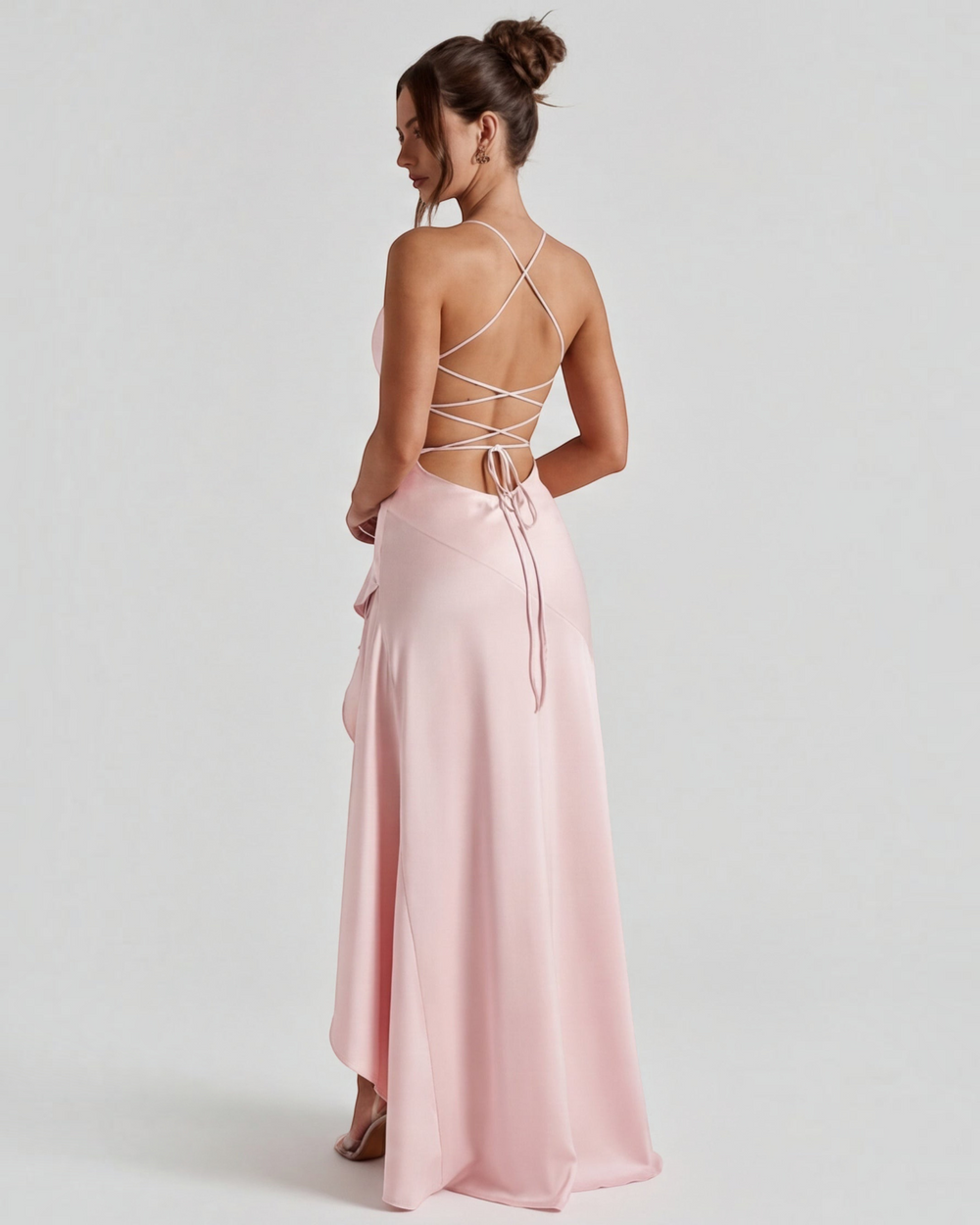 Luna Moda pale pink satin evening gown with a draped back, adjustable crisscross ties, and a high leg slit.
