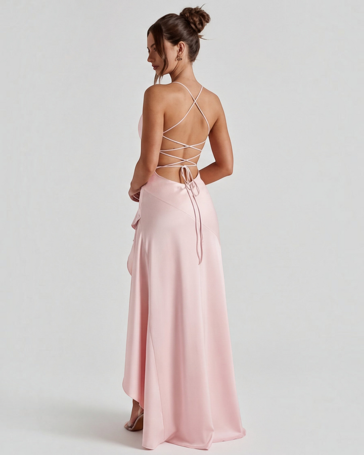 Luna Moda pale pink satin evening gown with a draped back, adjustable crisscross ties, and a high leg slit.