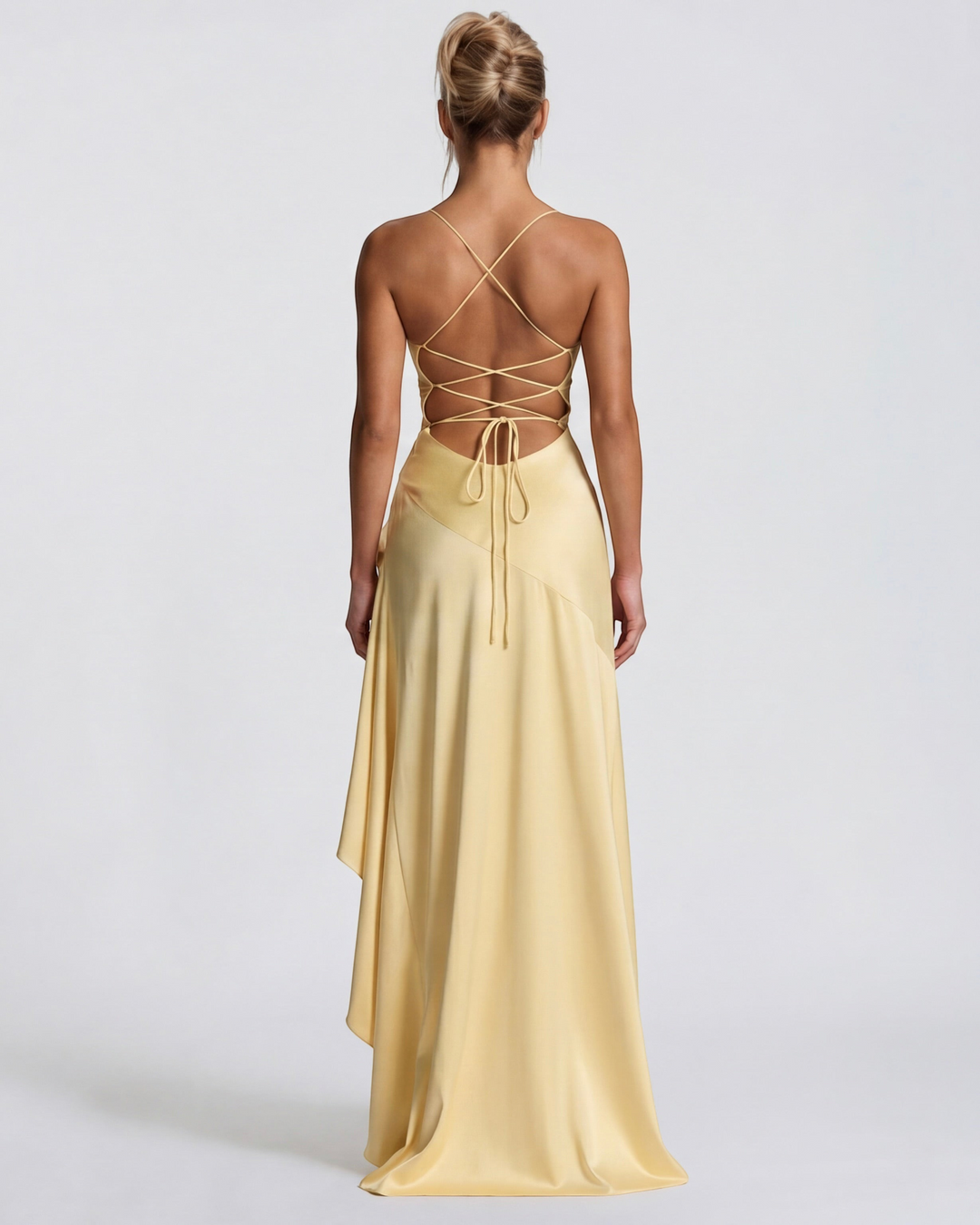 Luna Moda pale yellow satin evening gown with a draped back, high slit, and adjustable crisscross tie straps.