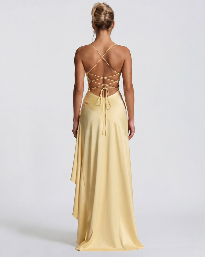 Luna Moda pale yellow satin evening gown with a draped back, high slit, and adjustable crisscross tie straps.