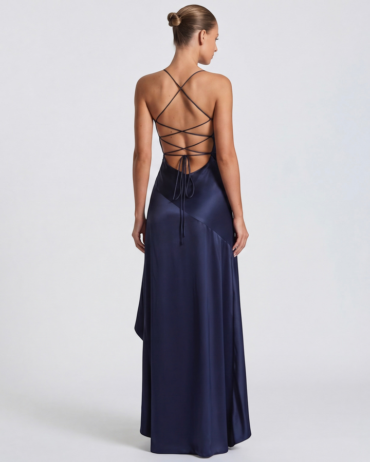Luna Moda Muse navy blue satin evening gown with a draped back, high slit, and adjustable crisscross tie straps.