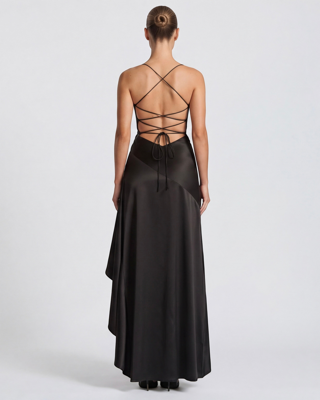 Luna Moda black satin evening gown featuring a draped back, adjustable crisscross ties, and a high-slit skirt.