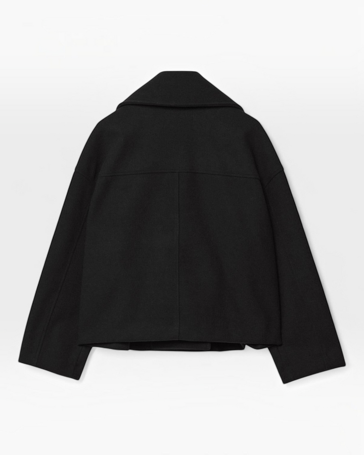 Luna Moda Costanza black cropped double-breasted jacket, back view showing structured collar and minimalist design.
