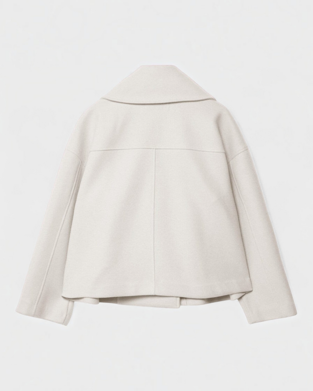 Luna Moda Costanza cream double-breasted short jacket with a wide collar, back view.