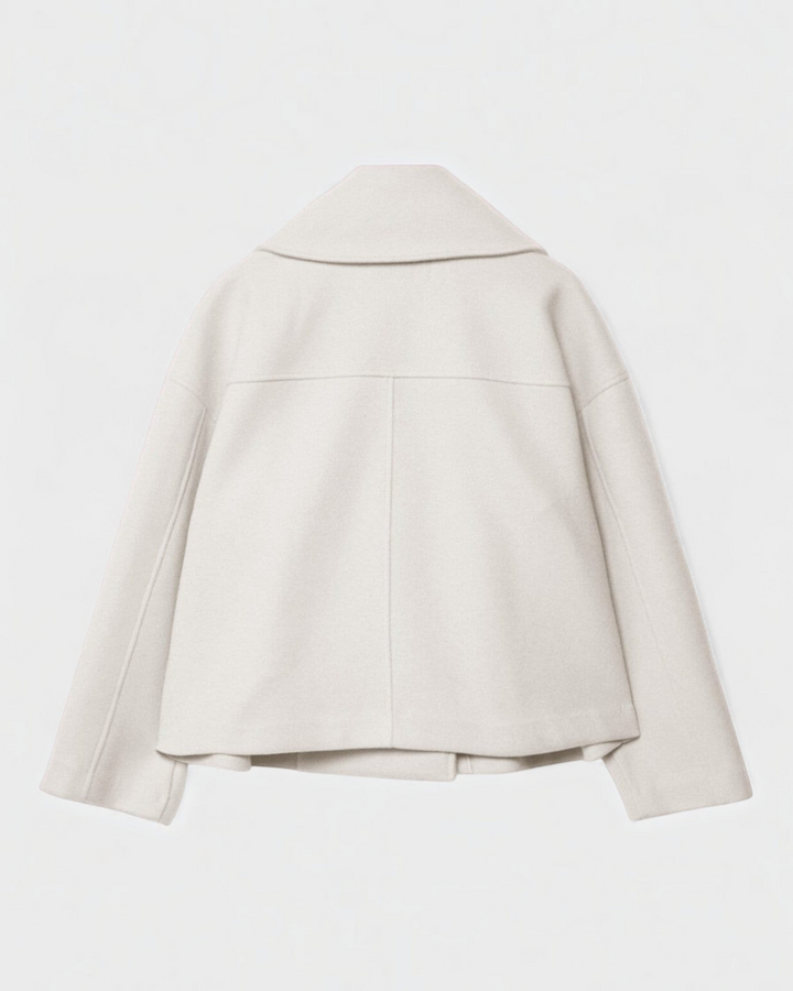 Luna Moda Costanza cream double-breasted short jacket with a wide collar, back view.