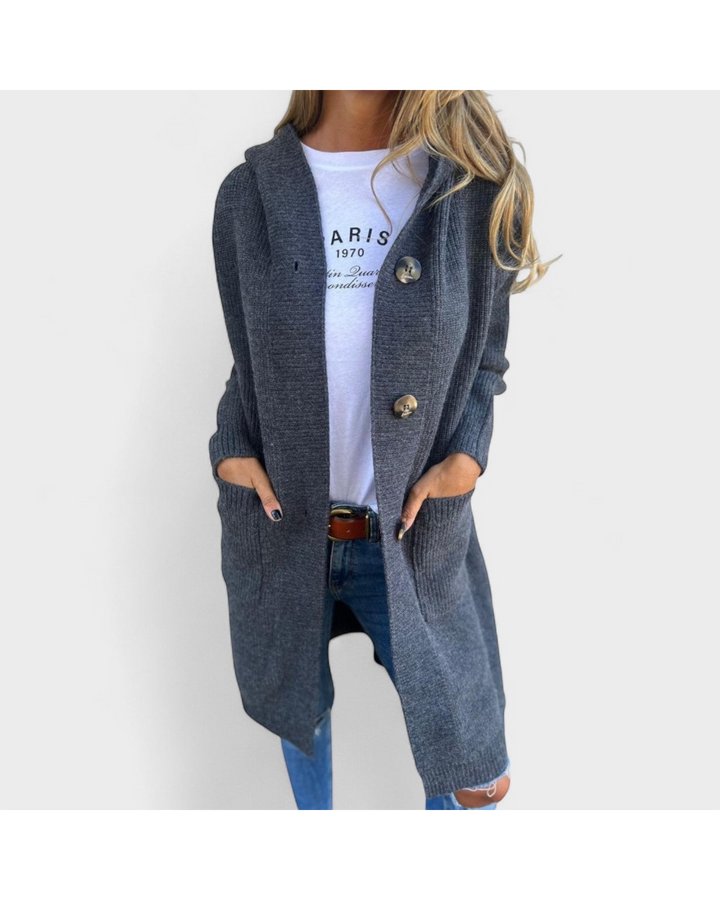 Luna Moda Beatriz long charcoal grey hooded knit cardigan with large buttons worn over a white graphic tee and jeans