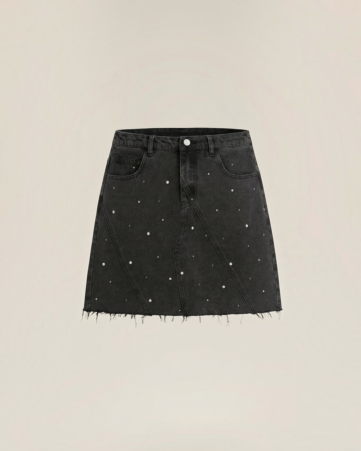 Luna Moda black denim mini skirt with pearl embellishments, high-waisted fit, and a raw frayed hem.