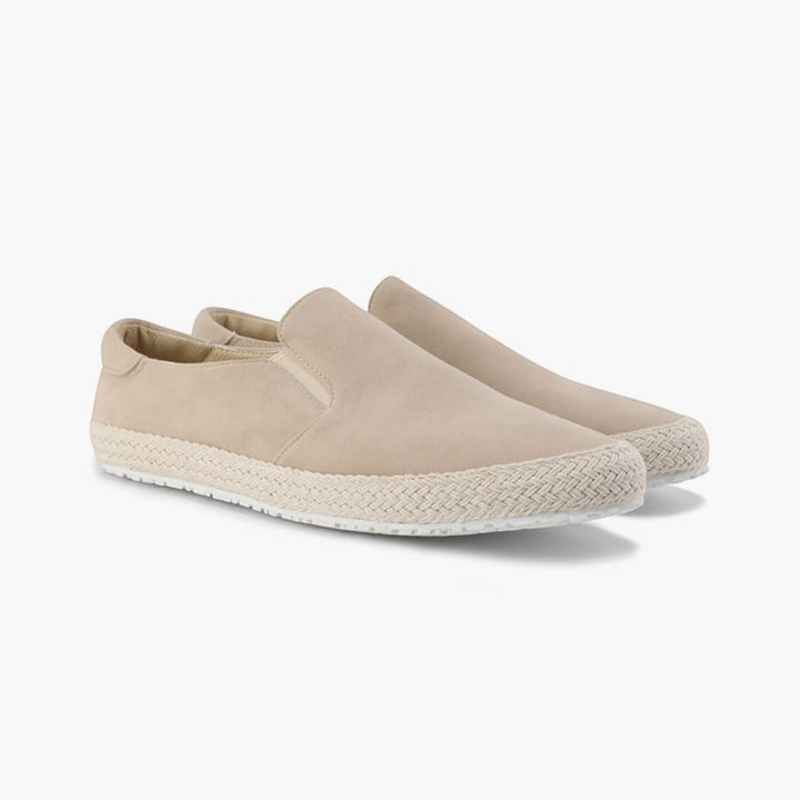 Luna Moda beige suede slip-on loafers with delicate stitching and a textured rubber sole for a casual look.