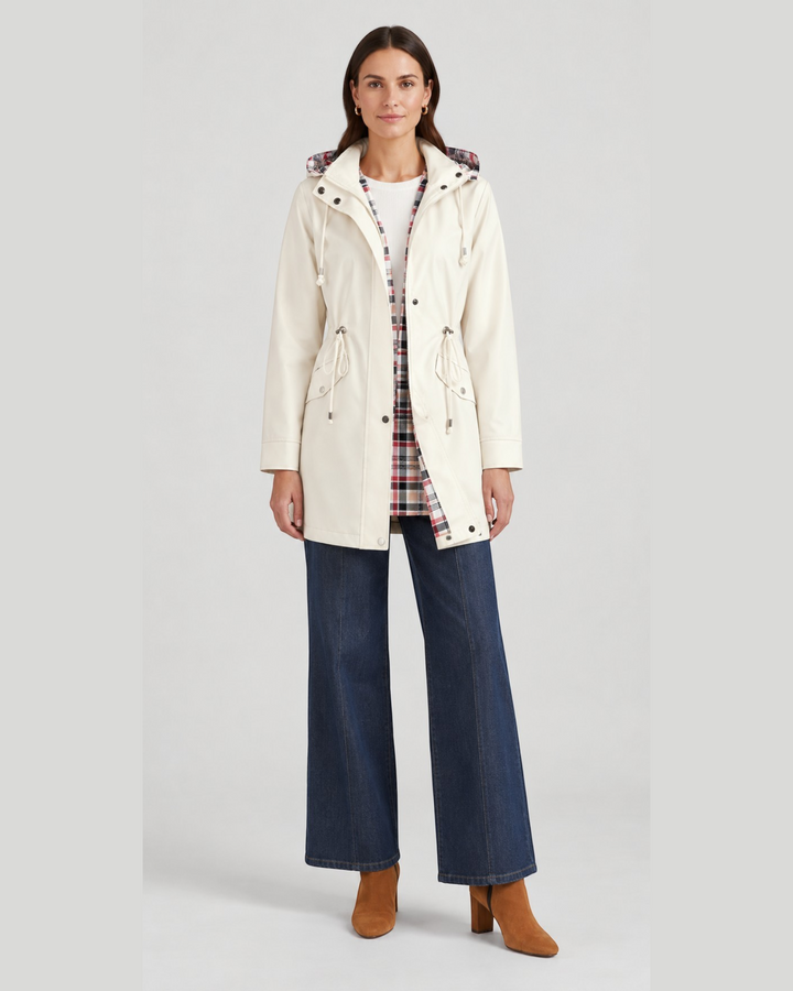 Luna Moda ADELINDA waterproof cream hooded jacket with adjustable waist and plaid lining worn by a model