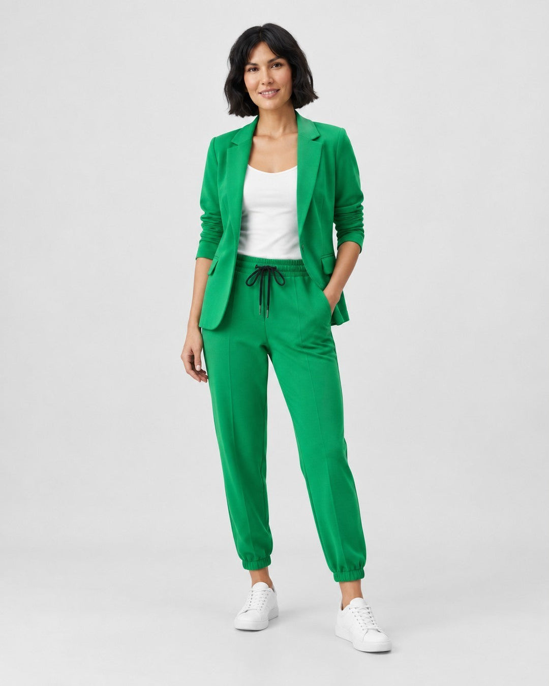 Luna Moda Adriana green fluid blazer and elastic waist trousers set worn by a woman with white sneakers