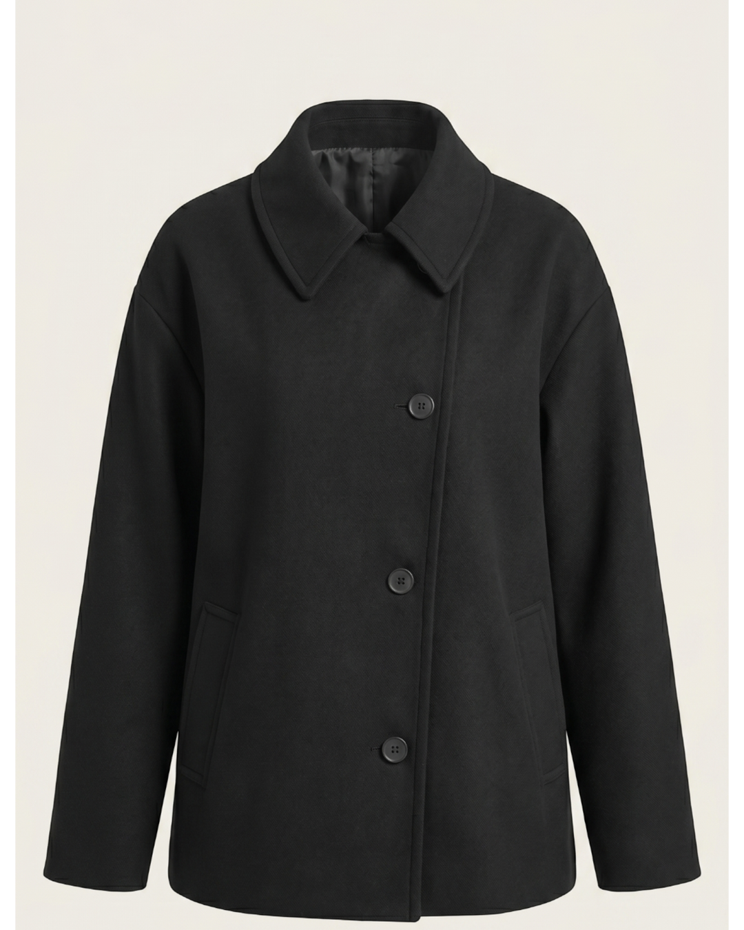 Luna Moda Amanda black oversized coat with an asymmetric button closure, classic collar, and front pockets.