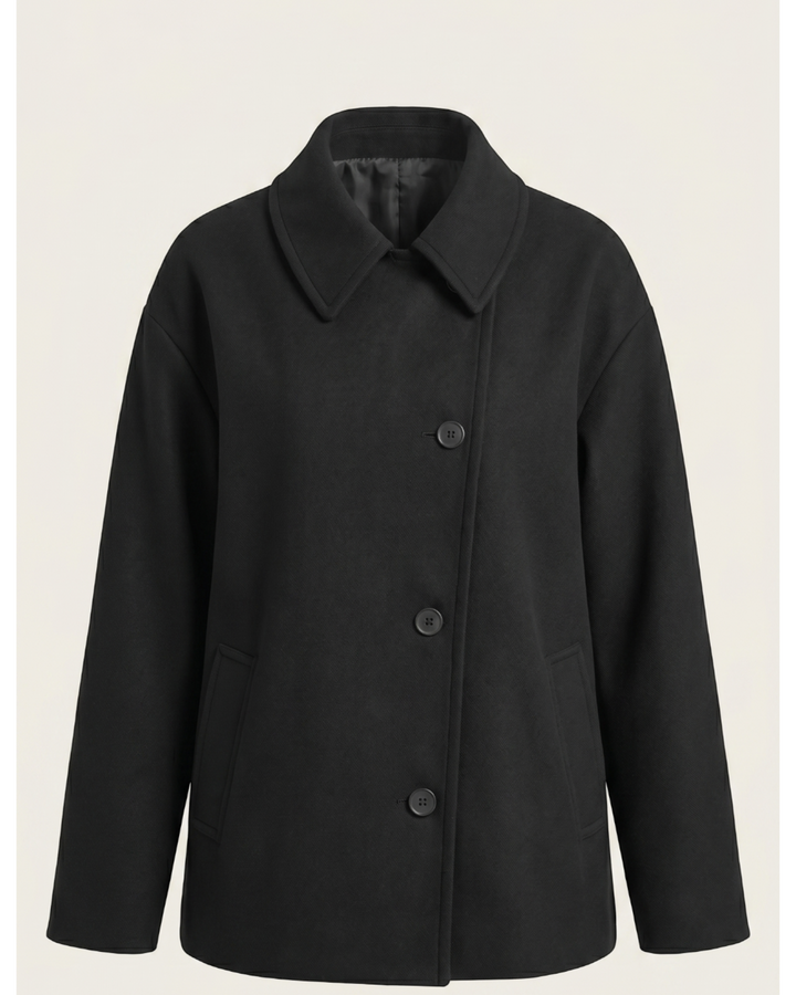Luna Moda Amanda black oversized coat with an asymmetric button closure, classic collar, and front pockets.