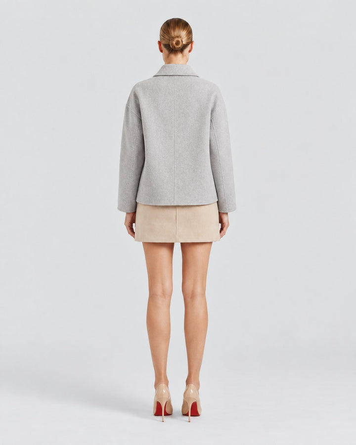 Luna Moda Amanda grey oversized coat worn by a model, back view showing classic collar and relaxed fit