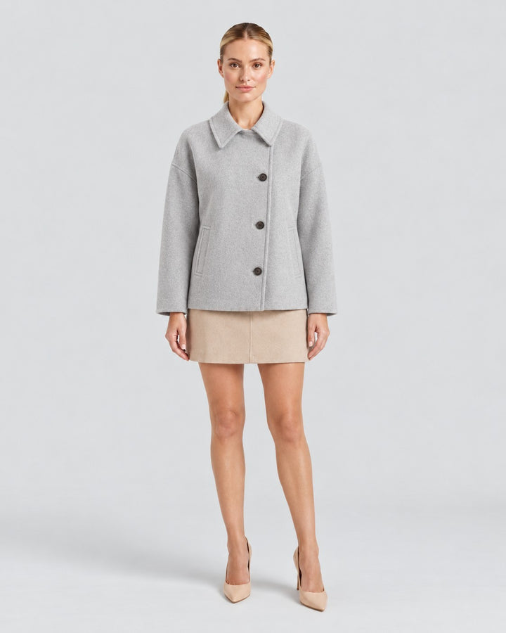 Luna Moda Amanda grey oversized wool coat with asymmetric button closure and classic collar worn by a model