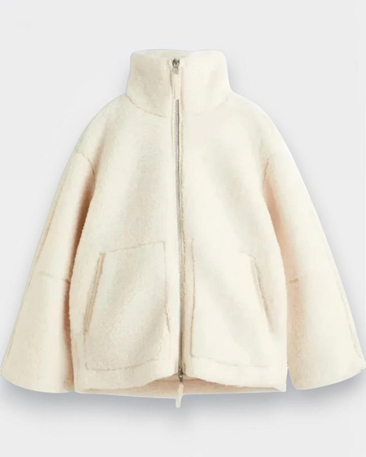 Luna Moda Anastasia cream fleece zip-up coat with a high collar and front pockets for winter comfort.