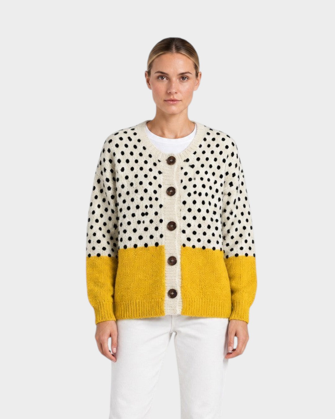Luna Moda Angelica vintage knit cardigan with cream polka dot top, mustard yellow bottom, and wooden buttons.