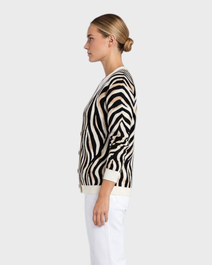 Luna Moda Serena cardigan featuring a brown, black, and white zebra animal print with a V-neck and button closure.
