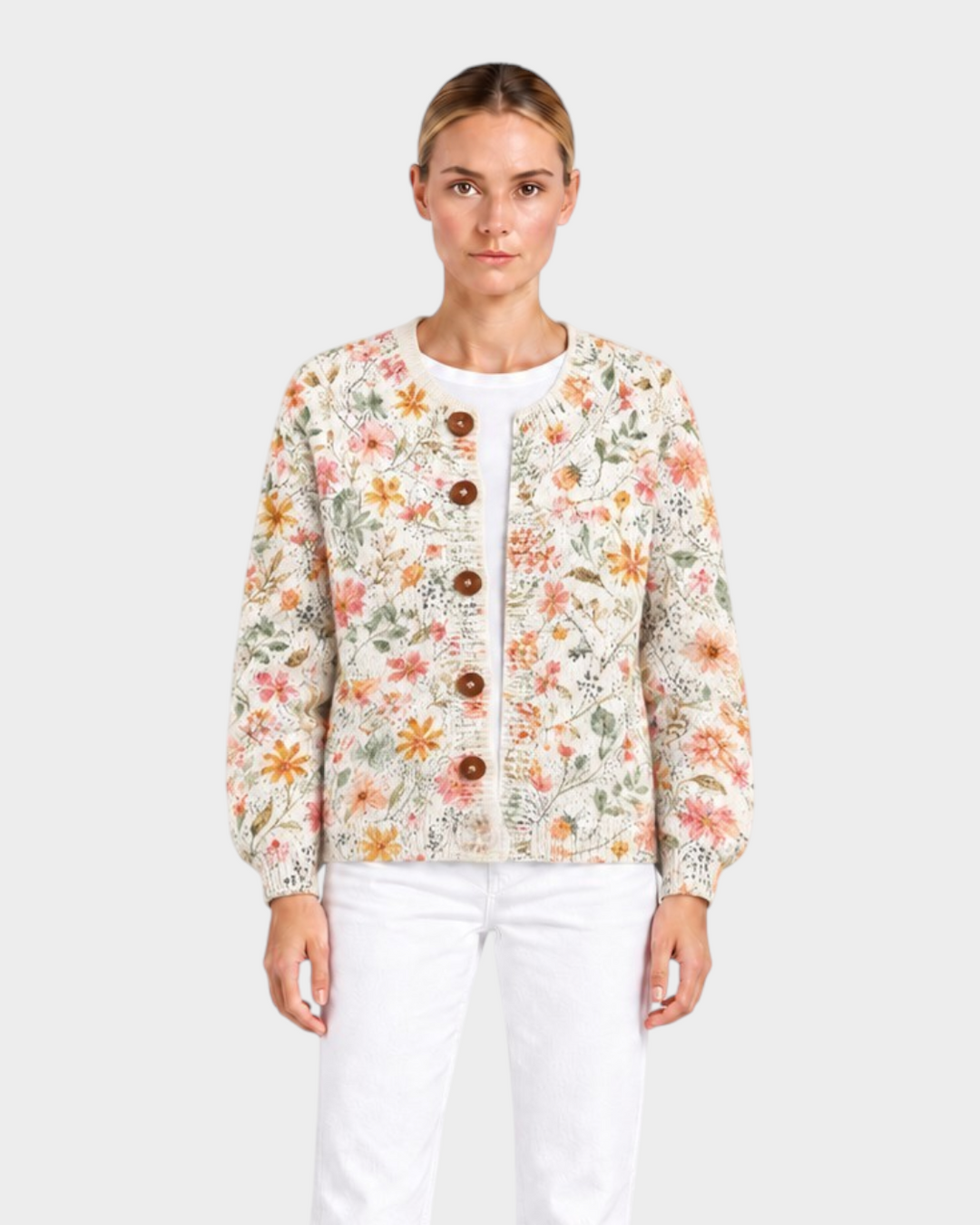 Luna Moda Anita cardigan with watercolor floral print in pink, peach, and sage, featuring wooden buttons and long sleeves