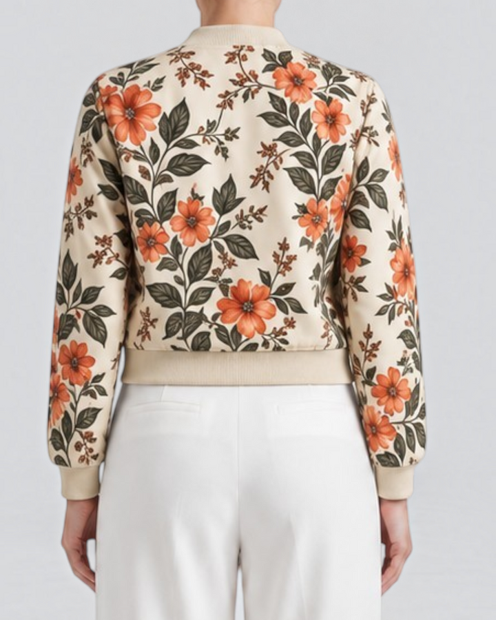 Luna Moda Arianna bomber jacket with vibrant floral print on beige polyester, worn with white trousers, back view.