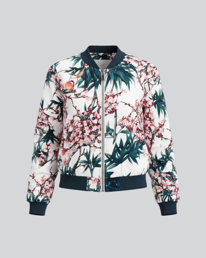 Luna Moda Arianna bomber jacket in white with a vibrant pink and green floral print and dark navy ribbed trim.