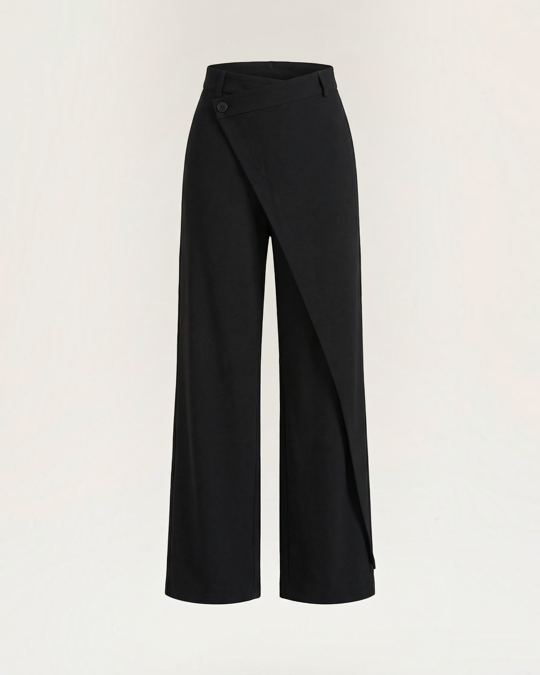 Luna Moda Licia black wide-leg trousers featuring an asymmetrical overlapping front panel and subtle button detail.