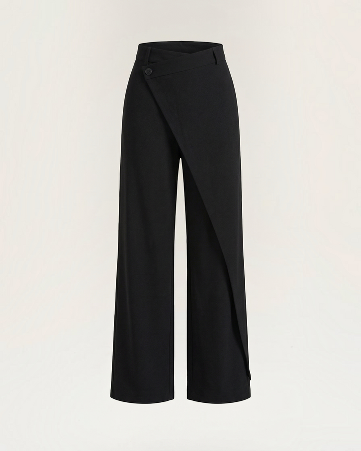 Luna Moda Licia black wide-leg trousers featuring an asymmetrical overlapping front panel and subtle button detail.