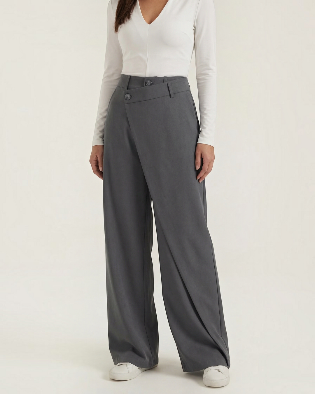 Luna Moda Licia wide-leg trousers in charcoal grey with an asymmetric wrap front panel and button detail.