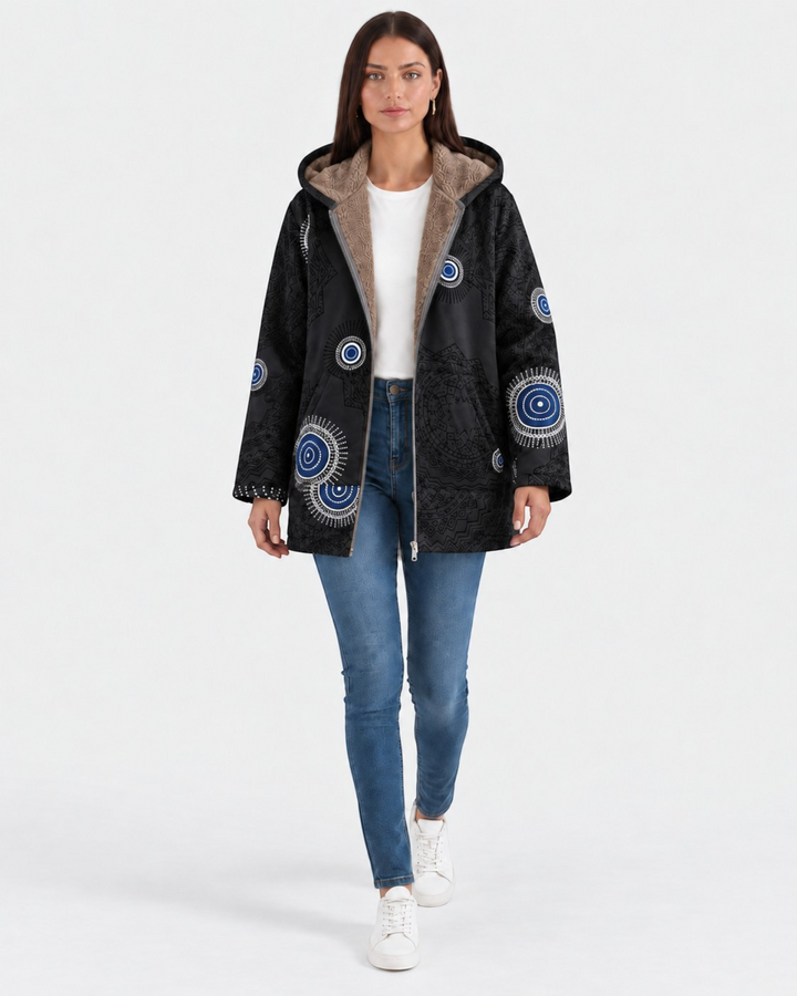 Luna Moda Aurora hooded jacket in black with geometric patterns and soft sherpa lining worn by a model
