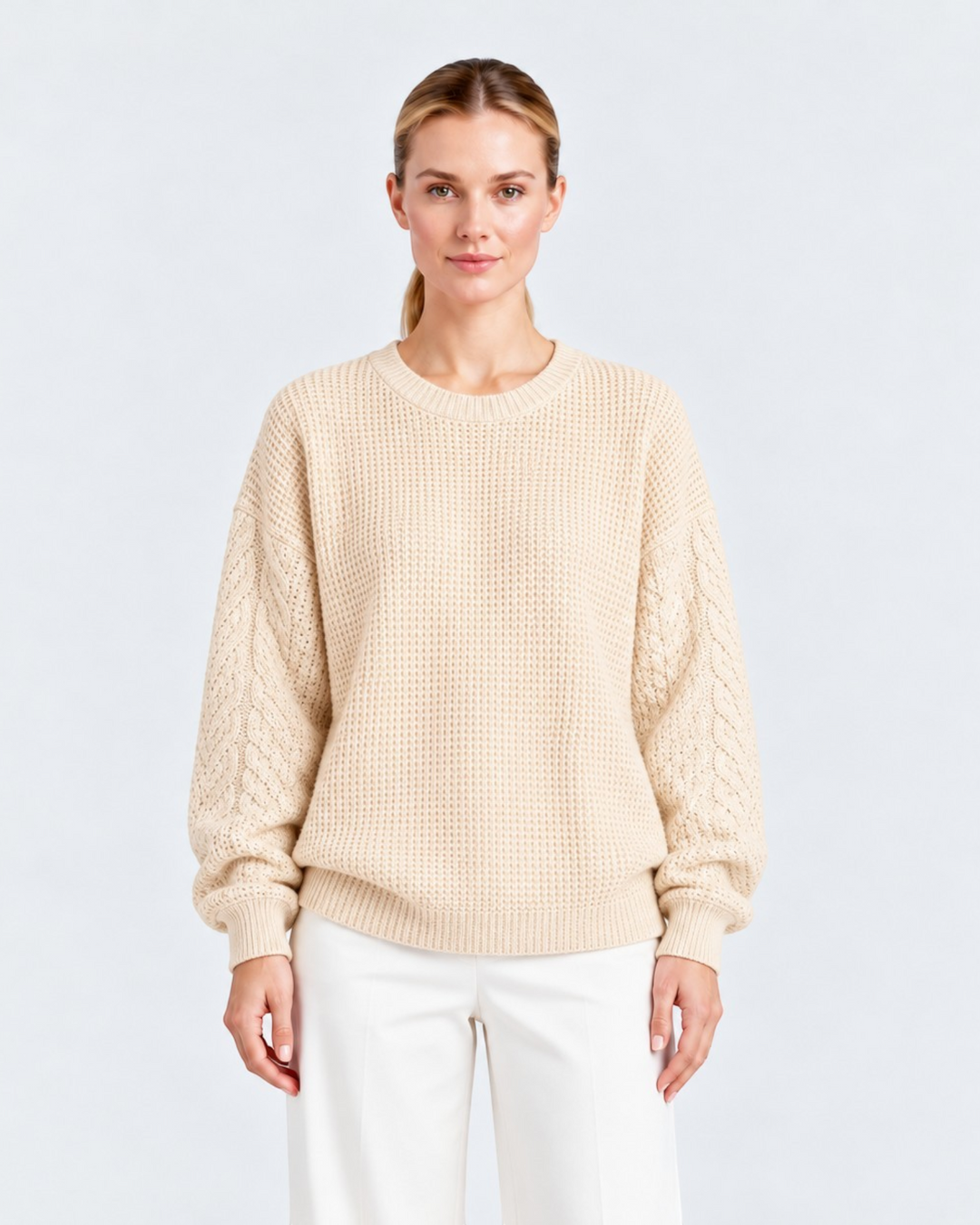 Luna Moda beige crew neck sweater with ribbed body and textured cable knit sleeves worn by a woman