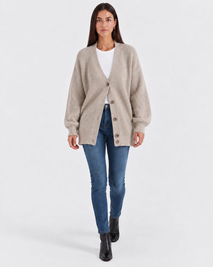 Luna Moda beige cashmere V-neck cardigan worn by a model with blue jeans and black boots