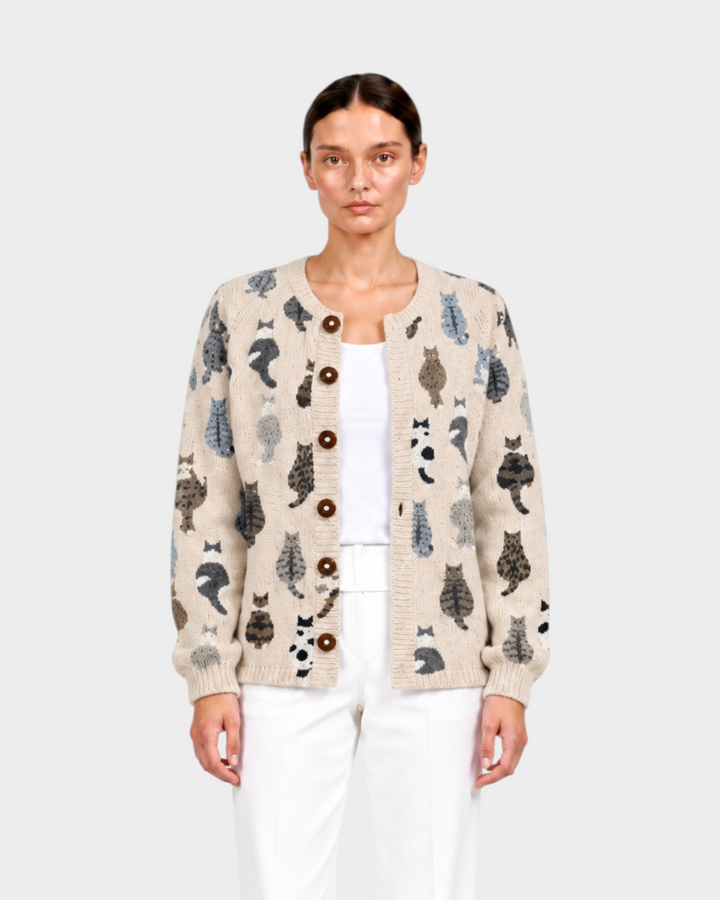Luna Moda Sofia beige knit cardigan with cute cat print, button-front closure, worn by a model with white trousers.