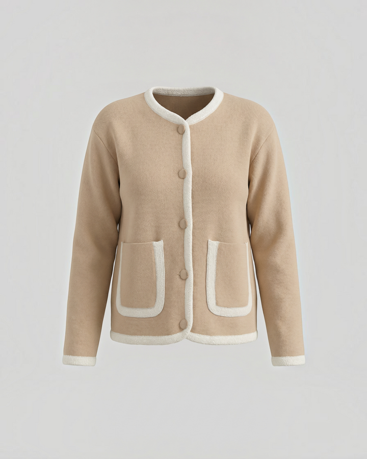 Luna Moda beige cropped cardigan with white contrast piping, front button closure, and two patch pockets.