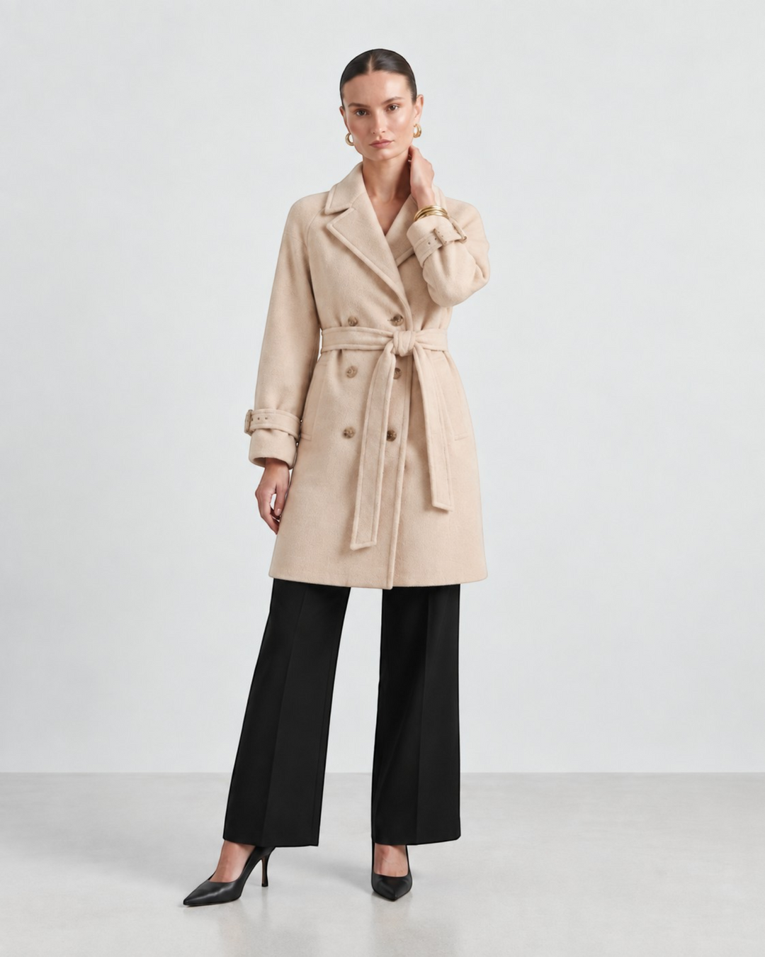 Luna Moda beige double-breasted trench coat with gold buttons, belted waist, and oversized lapels on a model.